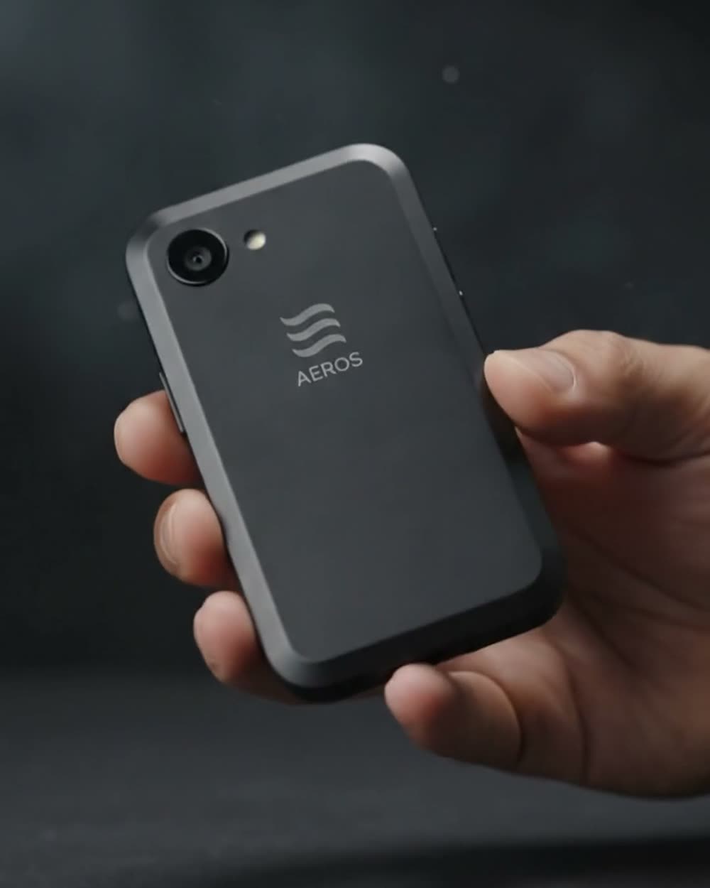 The concept phone resting in one open hand, well clear of the fingertips