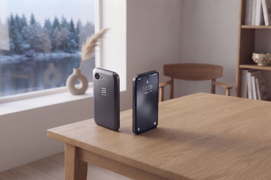 The concept phone on an oak table, snow through the window