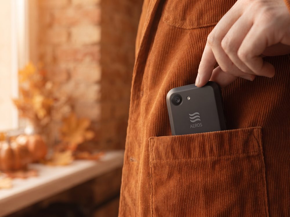 The concept phone going into a corduroy jacket pocket, autumn light